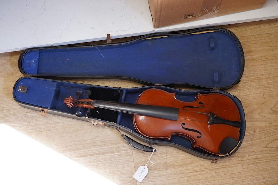 A cased students violin